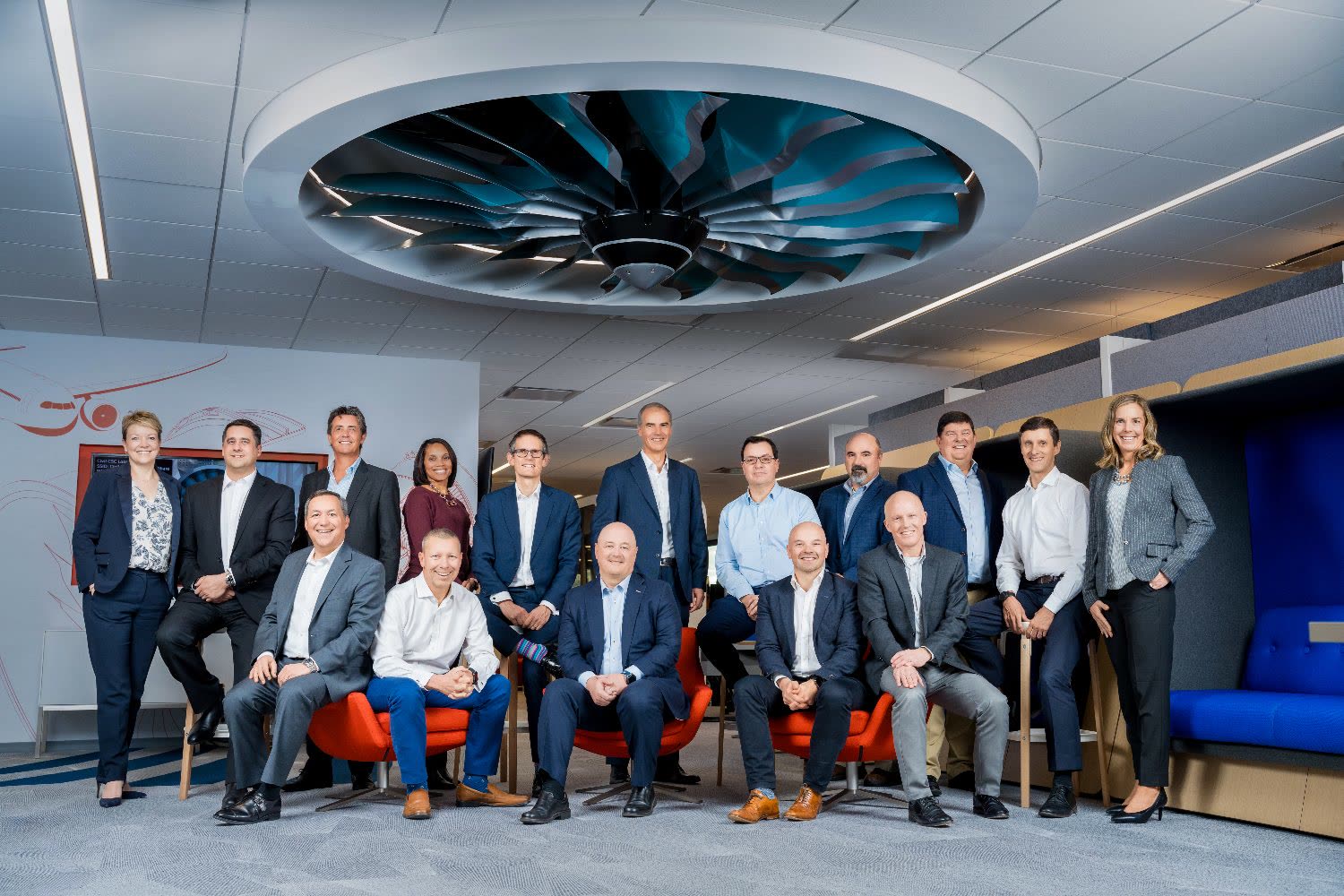 A business team poses together in a modern office, brand photography by Jorge Amaya