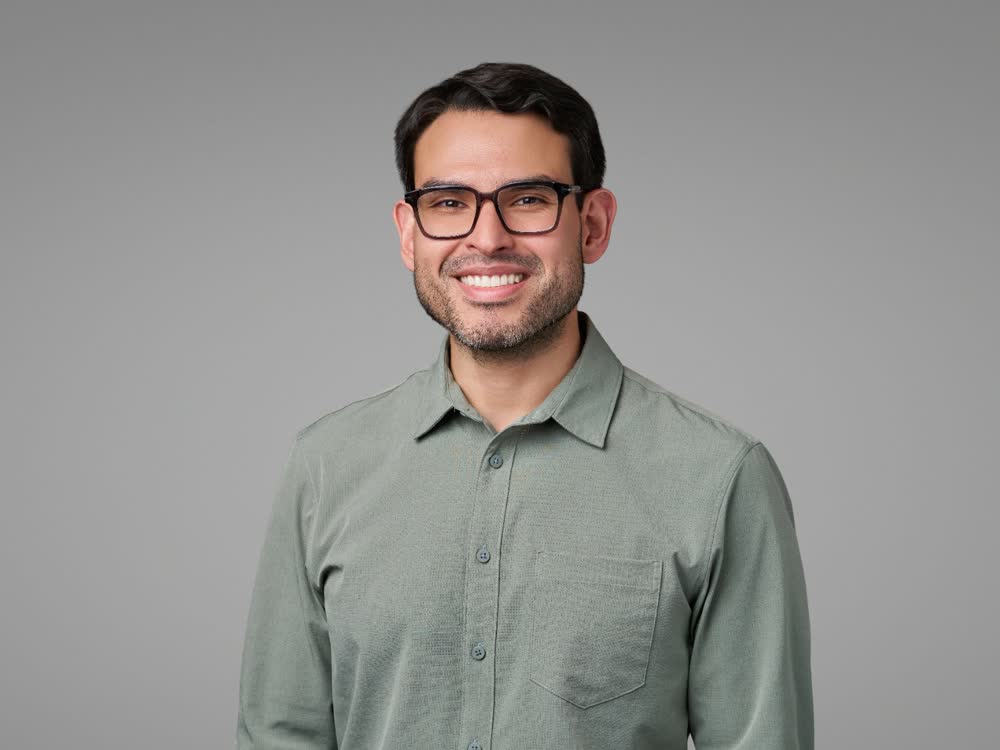 Corporate headshot subject photographed against a consistent studio setup